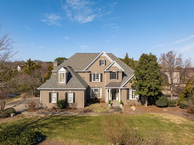 view of front of house with a front lawn