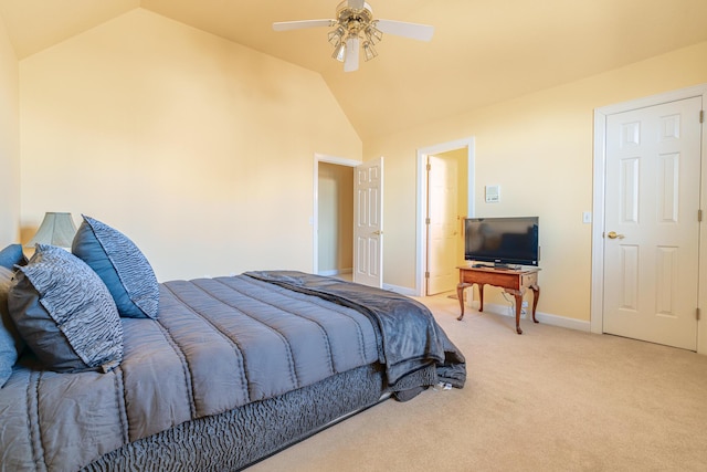 carpeted bedroom featuring ceiling fan and vaulted ceiling