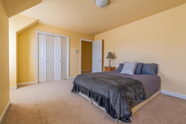 carpeted bedroom featuring a closet