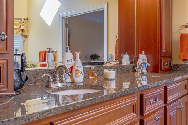 bathroom featuring vanity and a skylight