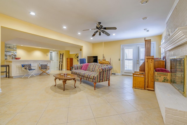 living room featuring light tile patterned floors and ceiling fan