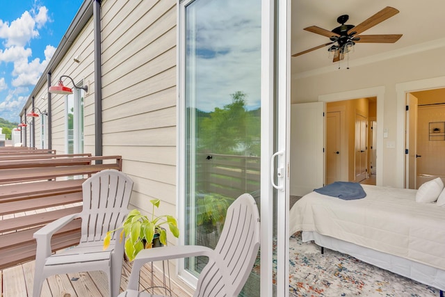 bedroom featuring ornamental molding and ceiling fan