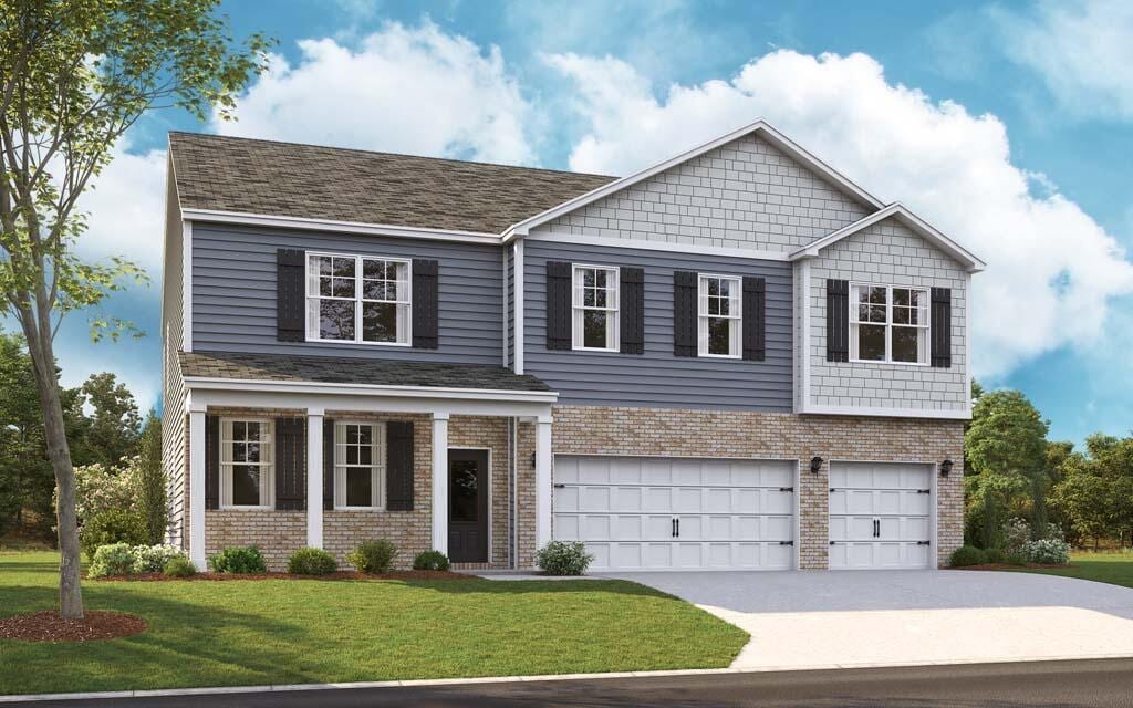 view of front of property featuring a garage and a front yard