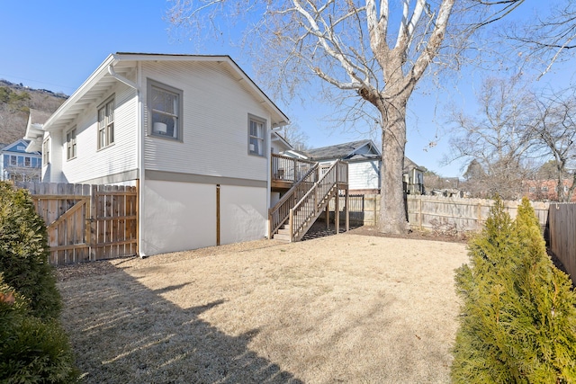 back of property featuring a deck