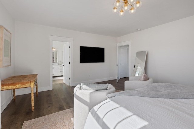 bedroom featuring ensuite bath, dark hardwood / wood-style flooring, and a notable chandelier