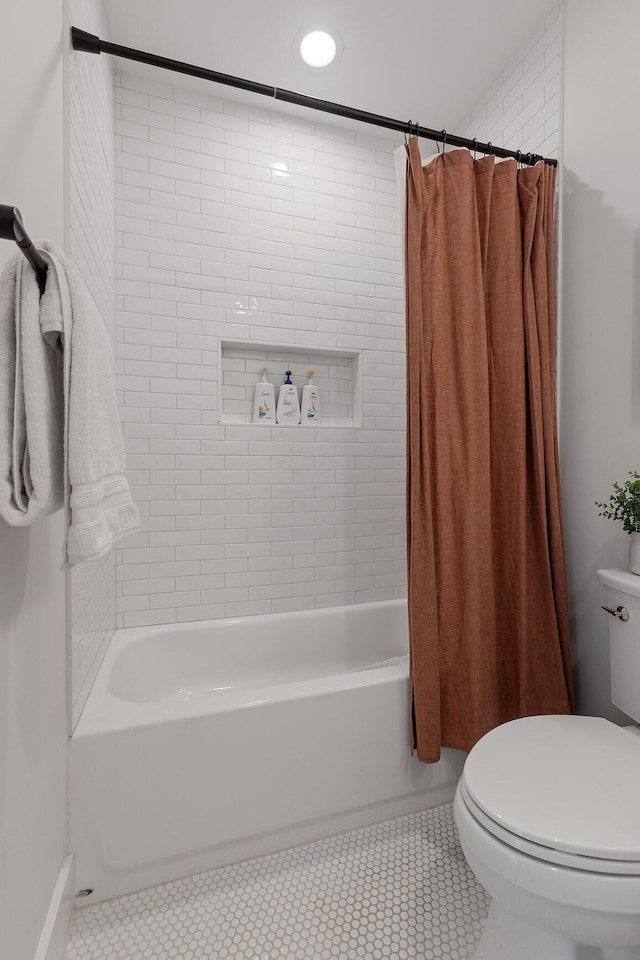 bathroom with toilet and shower / bath combo with shower curtain