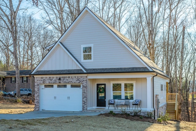 view of front of house with a garage and covered porch