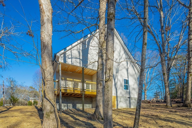 back of house featuring a deck