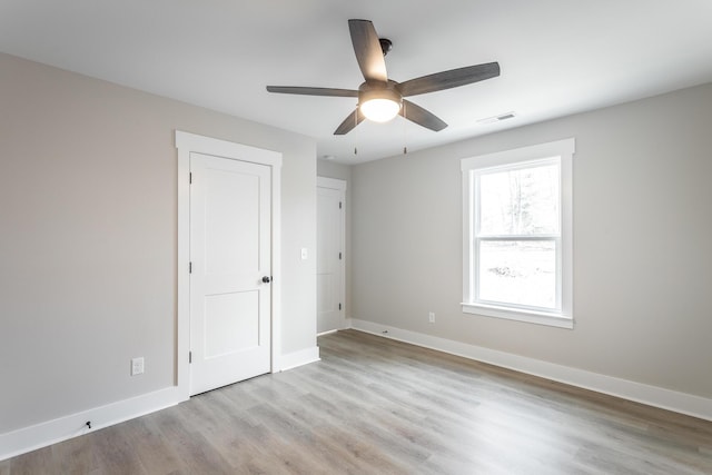 unfurnished bedroom with light wood-type flooring and ceiling fan