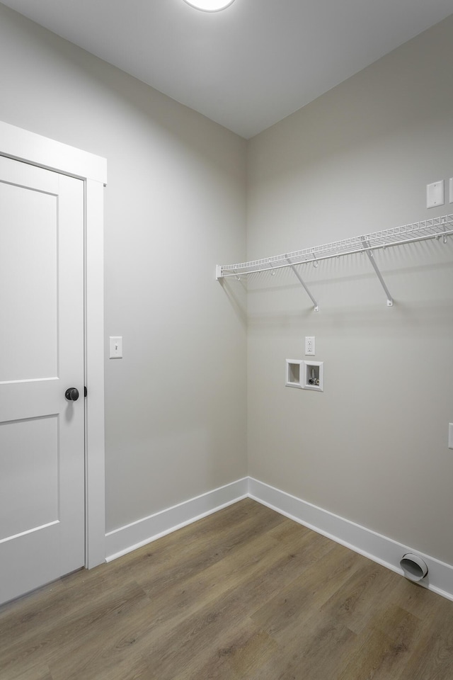 washroom with washer hookup and hardwood / wood-style floors