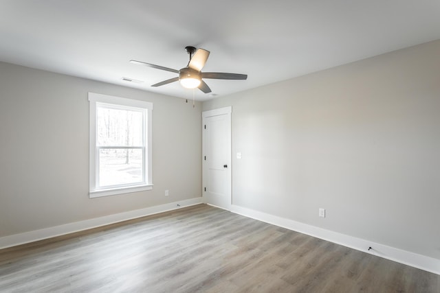 unfurnished room featuring ceiling fan and light hardwood / wood-style floors