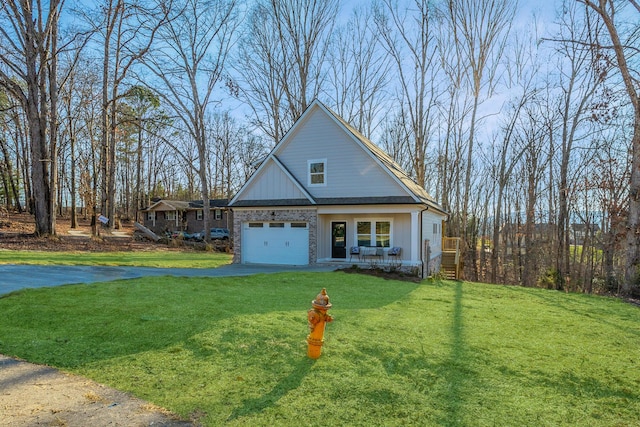 view of front of house with a garage and a front yard