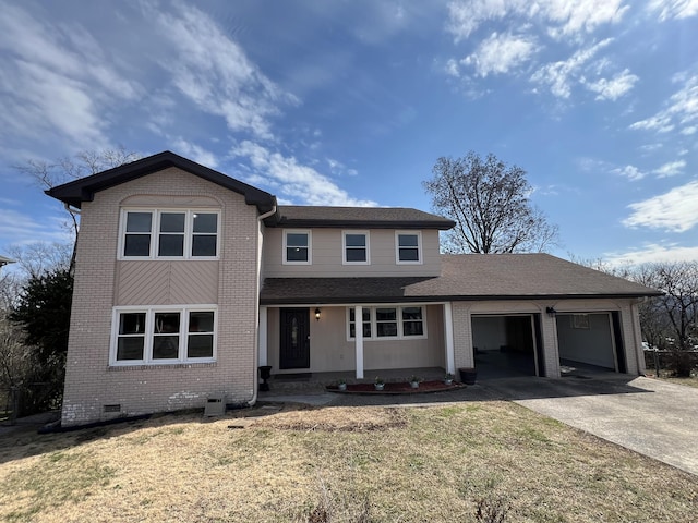 traditional-style home with concrete driveway, brick siding, crawl space, and an attached garage