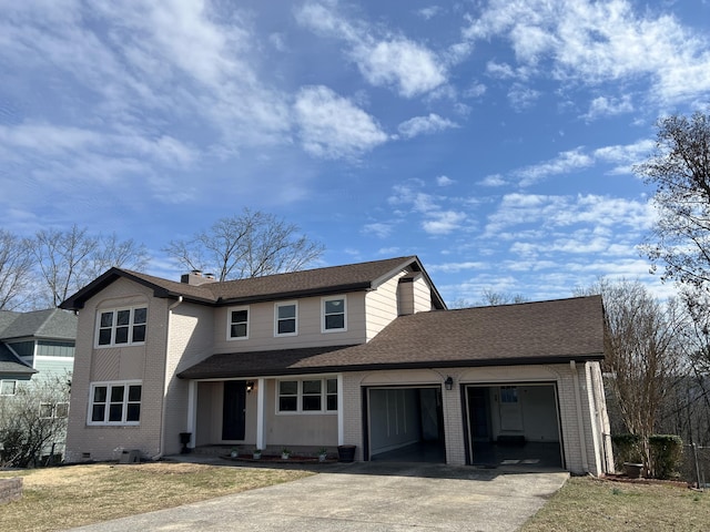 traditional home featuring a garage, concrete driveway, and brick siding