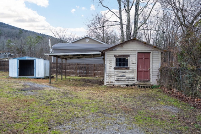 view of outbuilding featuring a carport and a mountain view