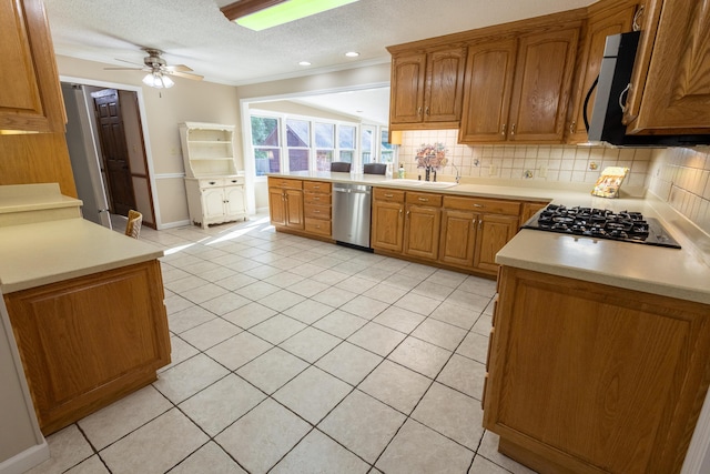446 Jamestown Rd, Menlo, GA 30731 - kitchen with sink, stainless steel appliances, tasteful backsplash, a textured ceiling, and light tile patterned flooring