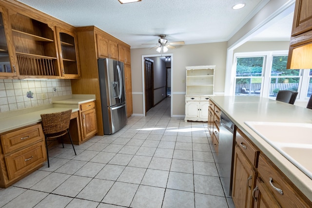 446 Jamestown Rd, Menlo, GA 30731 - kitchen featuring appliances with stainless steel finishes, built in desk, tasteful backsplash, light tile patterned floors, and ceiling fan