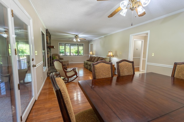 446 Jamestown Rd, Menlo, GA 30731 - dining area featuring ceiling fan, wood-type flooring, ornamental molding, and a textured ceiling