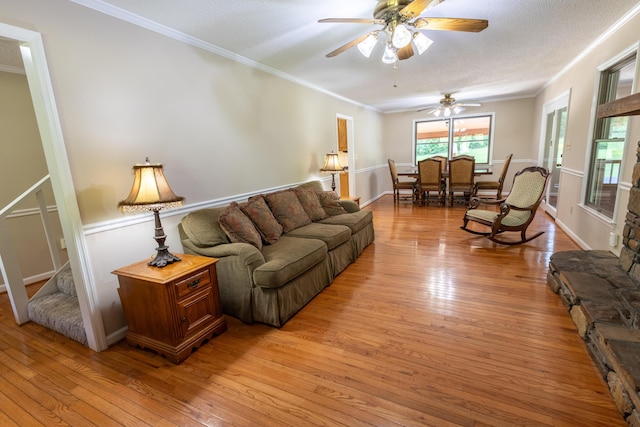 446 Jamestown Rd, Menlo, GA 30731 - living room with crown molding, ceiling fan, a textured ceiling, and light hardwood / wood-style flooring