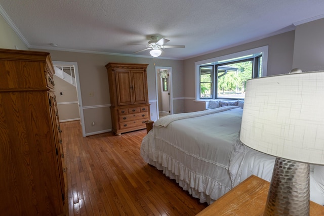 446 Jamestown Rd, Menlo, GA 30731 - bedroom with hardwood / wood-style floors, crown molding, a textured ceiling, and ceiling fan