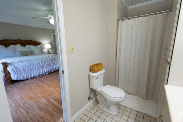 446 Jamestown Rd, Menlo, GA 30731 - bathroom with crown molding, ceiling fan, wood-type flooring, toilet, and walk in shower