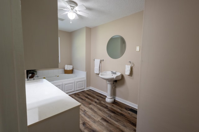 446 Jamestown Rd, Menlo, GA 30731 - bathroom with hardwood / wood-style flooring, a bathtub, and a textured ceiling
