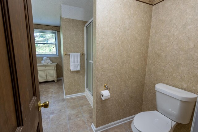 446 Jamestown Rd, Menlo, GA 30731 - bathroom with tile patterned flooring, an enclosed shower, a textured ceiling, and toilet