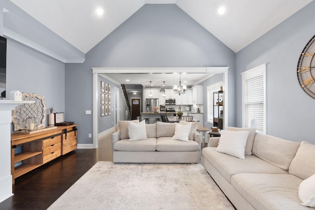 living room featuring recessed lighting, a chandelier, wood finished floors, high vaulted ceiling, and baseboards