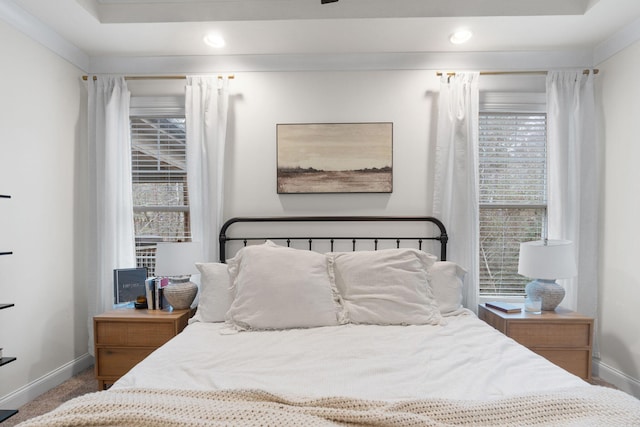 bedroom featuring multiple windows and crown molding