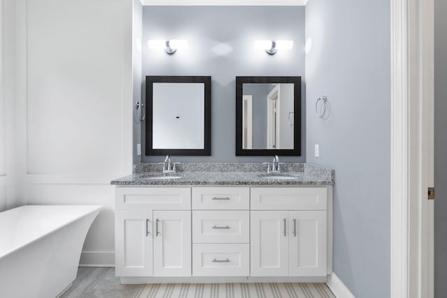 bathroom with vanity and a bathing tub