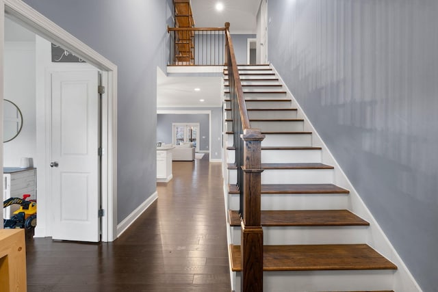 stairs with recessed lighting, wood finished floors, and baseboards