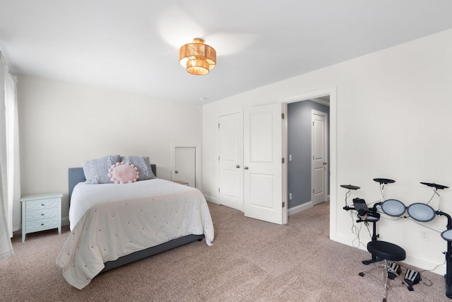 carpeted bedroom featuring baseboards