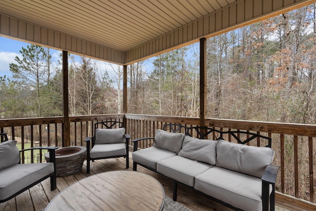 sunroom featuring wood ceiling