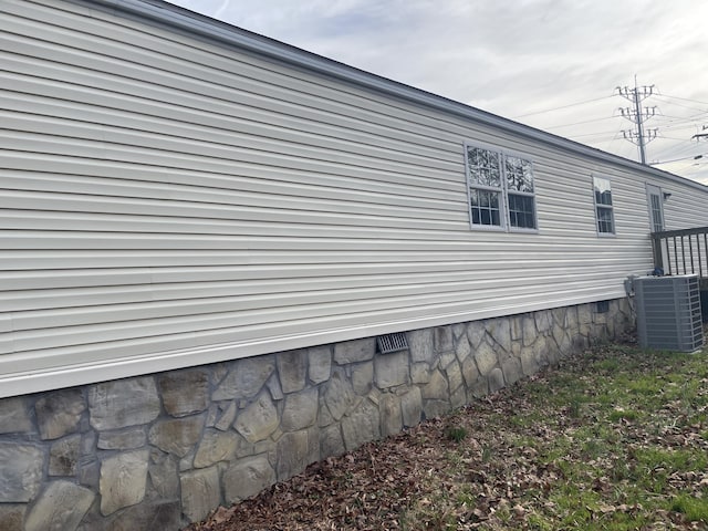 view of home's exterior with central AC unit