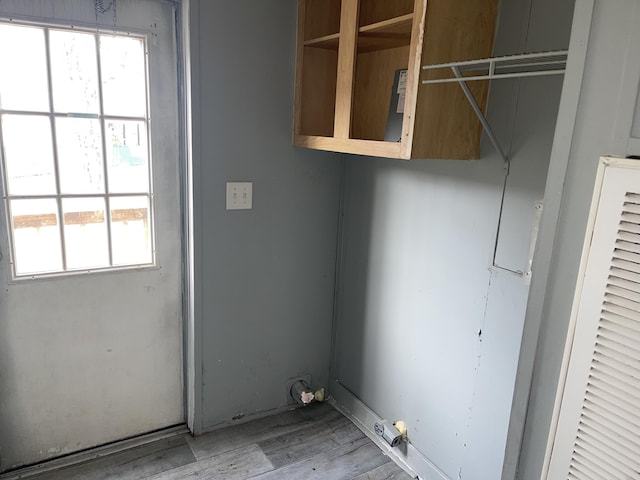 laundry area featuring light hardwood / wood-style flooring