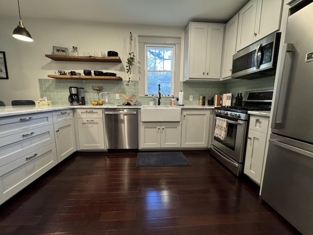 kitchen featuring sink, white cabinets, and appliances with stainless steel finishes