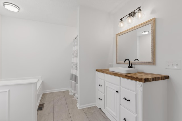 bathroom featuring vanity and a textured ceiling