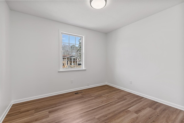 empty room featuring hardwood / wood-style floors