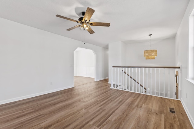 empty room featuring hardwood / wood-style flooring and ceiling fan