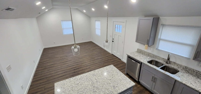 kitchen featuring light stone countertops, sink, stainless steel dishwasher, and gray cabinetry