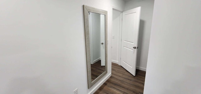 hallway featuring dark hardwood / wood-style floors