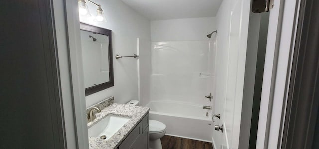 full bathroom with shower / bathtub combination, vanity, toilet, and wood-type flooring