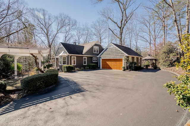 view of front of house featuring a garage and a gazebo