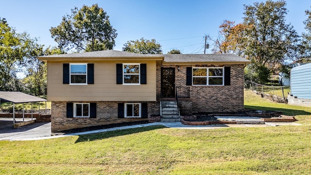 view of front of property with a carport and a front yard