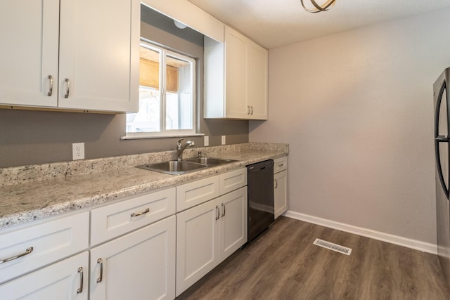 kitchen featuring sink, dark wood-type flooring, black appliances, light stone countertops, and white cabinets