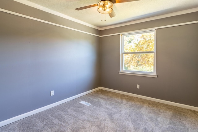 unfurnished room featuring ceiling fan, carpet flooring, and a textured ceiling