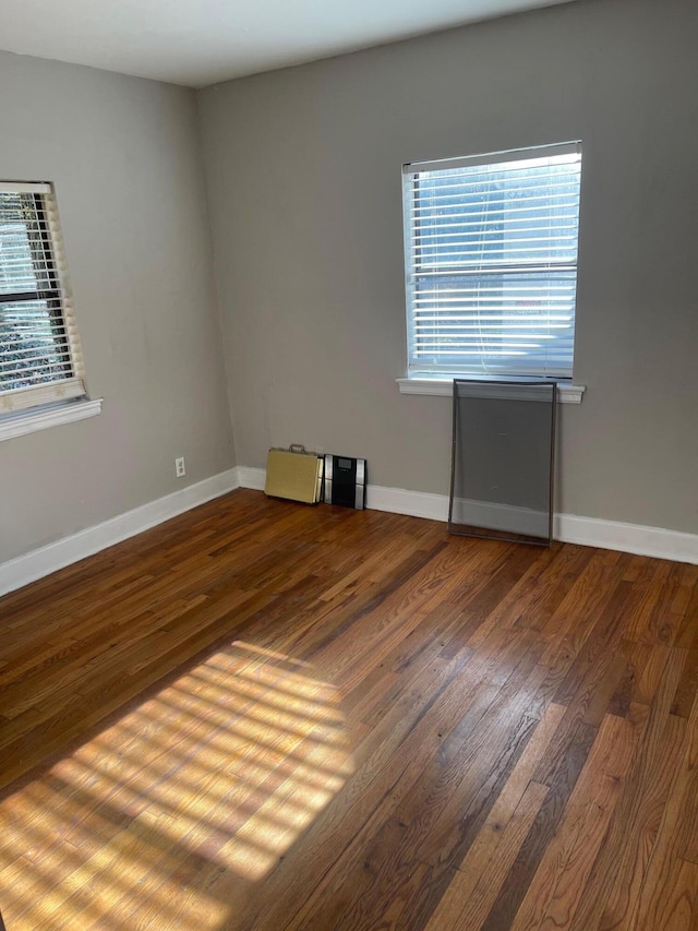 empty room with wood-type flooring