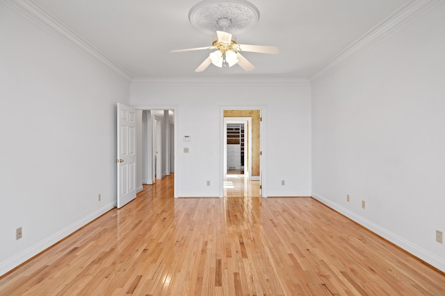 unfurnished room with light wood-type flooring, crown molding, baseboards, and ceiling fan