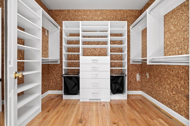 walk in closet featuring light wood-type flooring