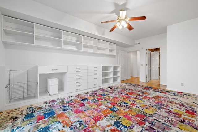 bedroom featuring a ceiling fan, visible vents, and baseboards